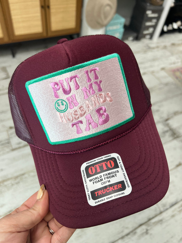 Put it on my Husbands Tab Trucker Hat